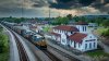 2024-04-30 - CSX coal passes the old Spanish style depot at South Bridgeport, Alabama.jpg