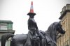 0_A-traffic-cone-is-balanced-on-the-head-o.jpg